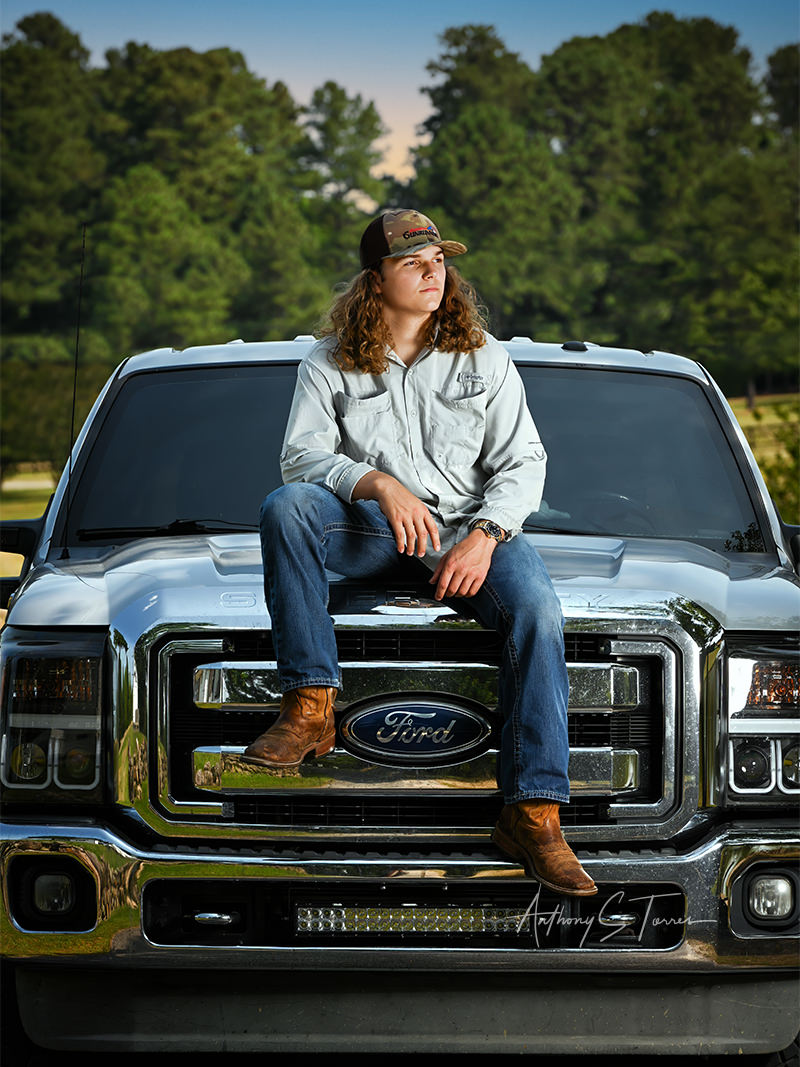 Coleson senior portrait on football field, Wake Forest NC